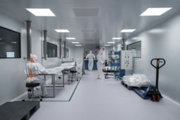 workers-in-protective-suits-inside-a-sterile-laboratory-.jpg Workers in protective suits inside a sterile laboratory.