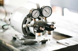 a-couple-of-gauges-sitting-on-top-of-a-table.jpg a couple of gauges sitting on top of a table