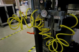 a-machine-with-yellow-hoses-attached-to-it.jpg a machine with yellow hoses attached to it